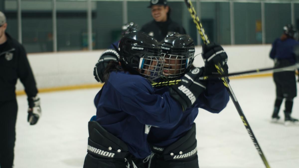 students playing hockey