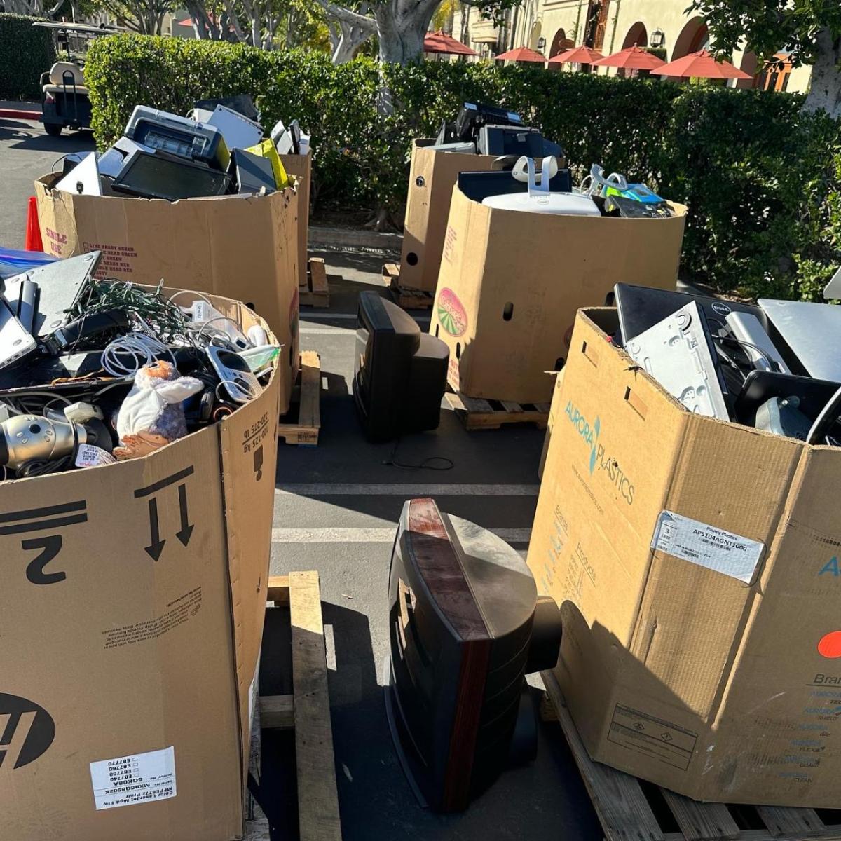 Cardboard boxes full of recycled electronics