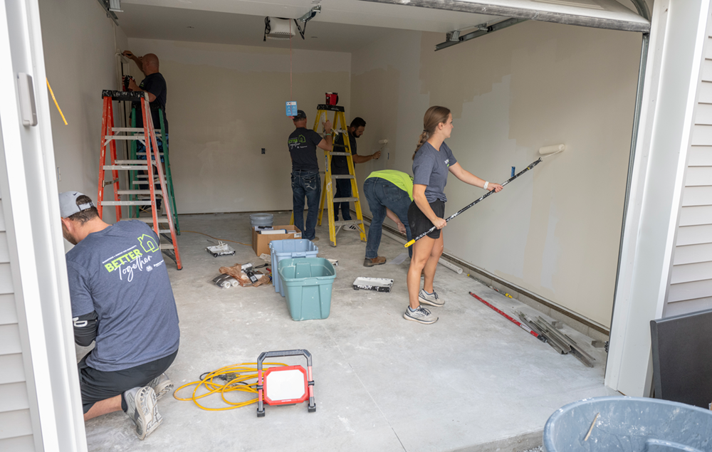 people working in a garage