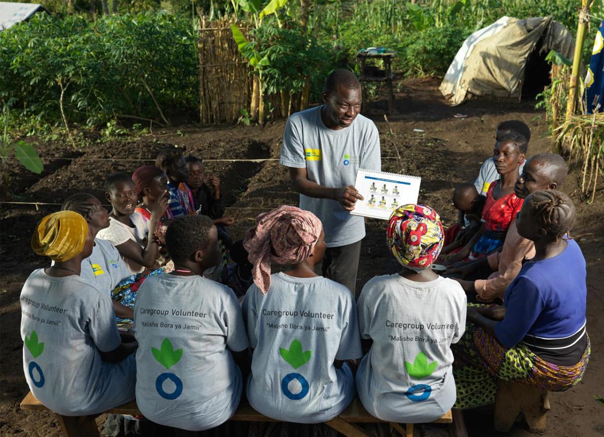 Rodger teaches fellow volunteers about the importance of a healthy diet.