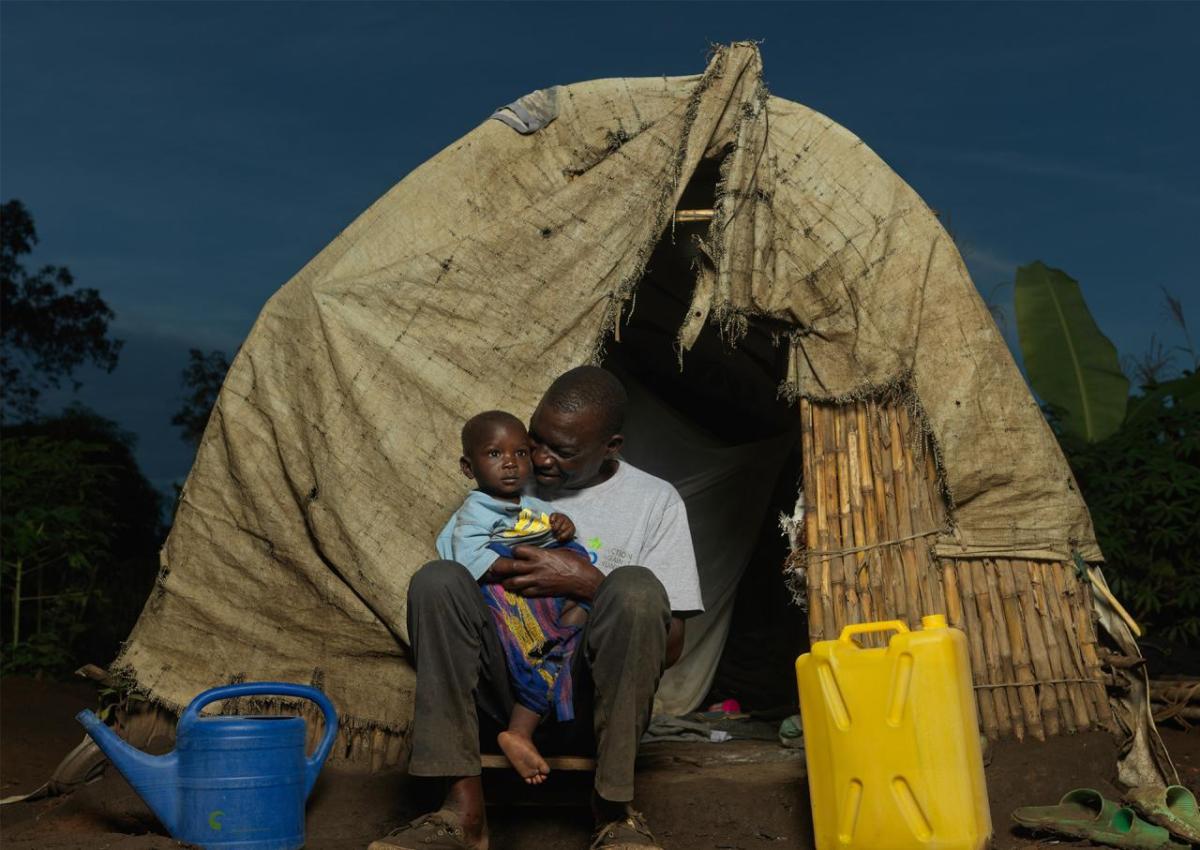 One year old, Musa Moize, and his father Rodger at home.