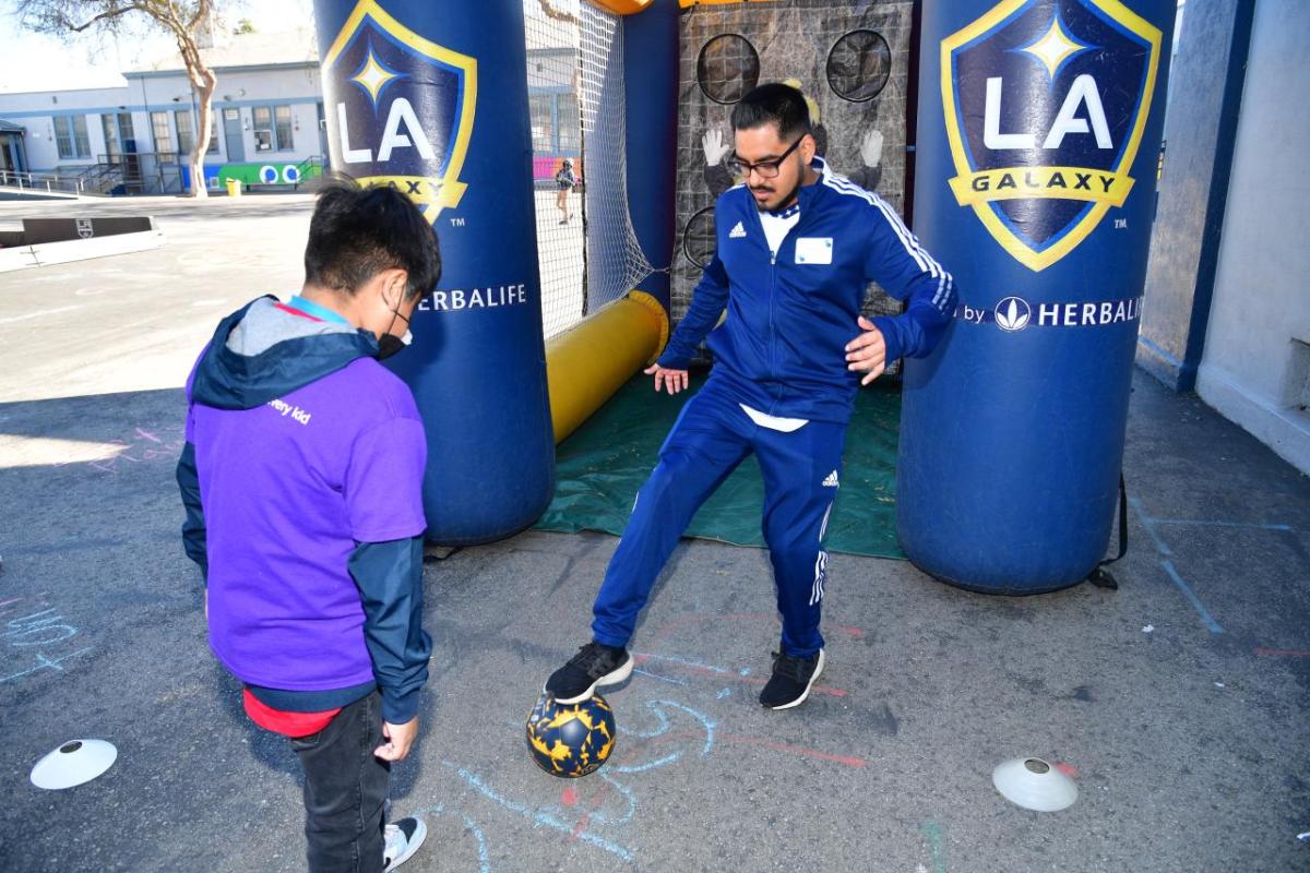 A student participates in the LA Galaxy's soccer clinic at AEG's Service Day.