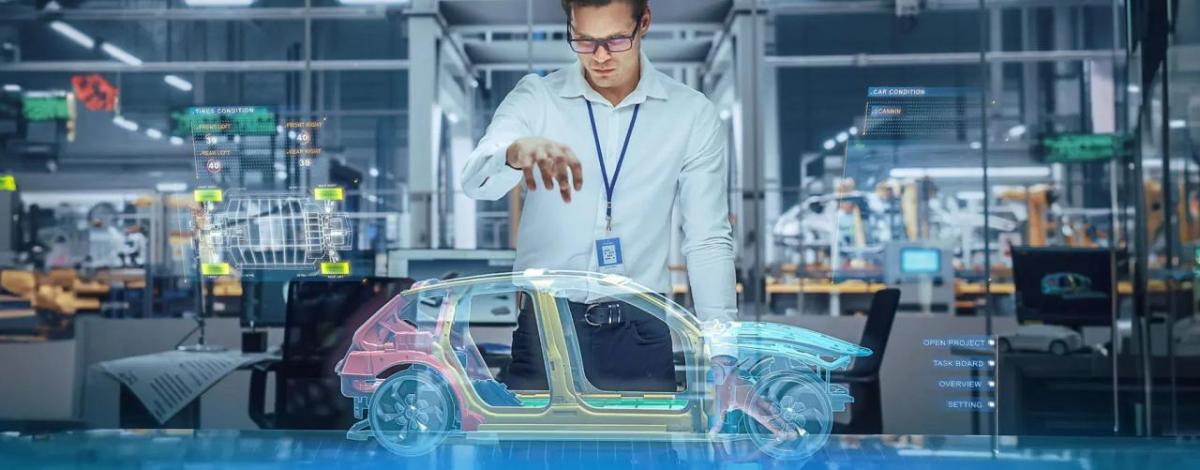 A person holding a hand over a holographic digital sketch of a car.