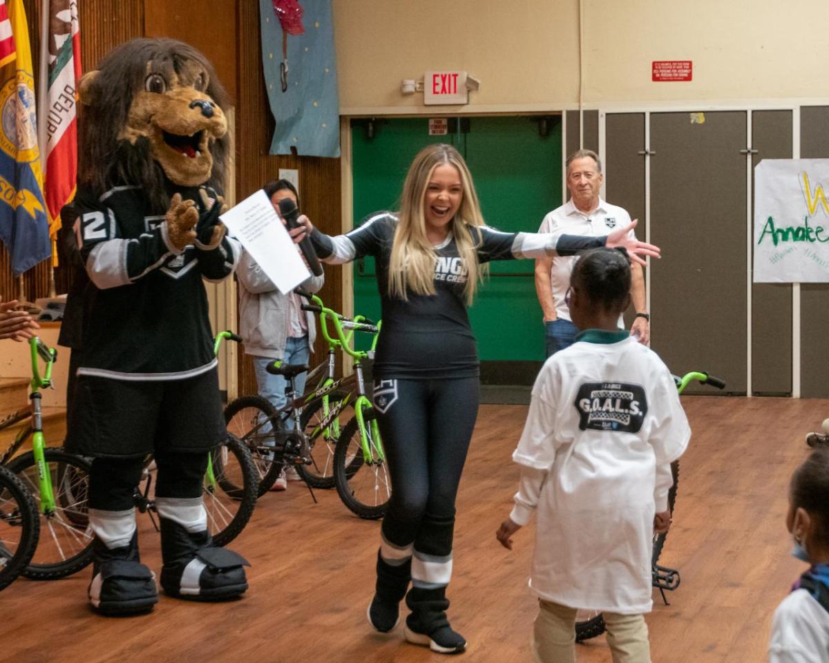 LA Kings Ice crew congratulates a student at the assembly.