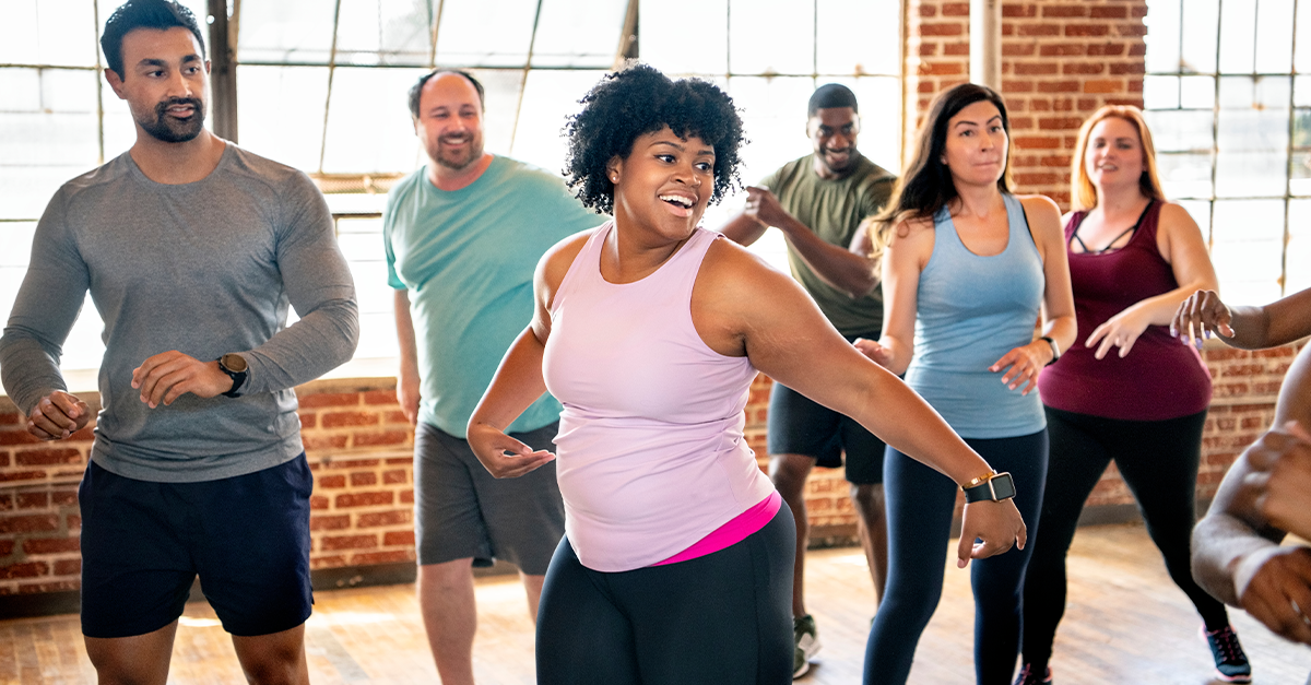 Group of people doing aerobic exercise.