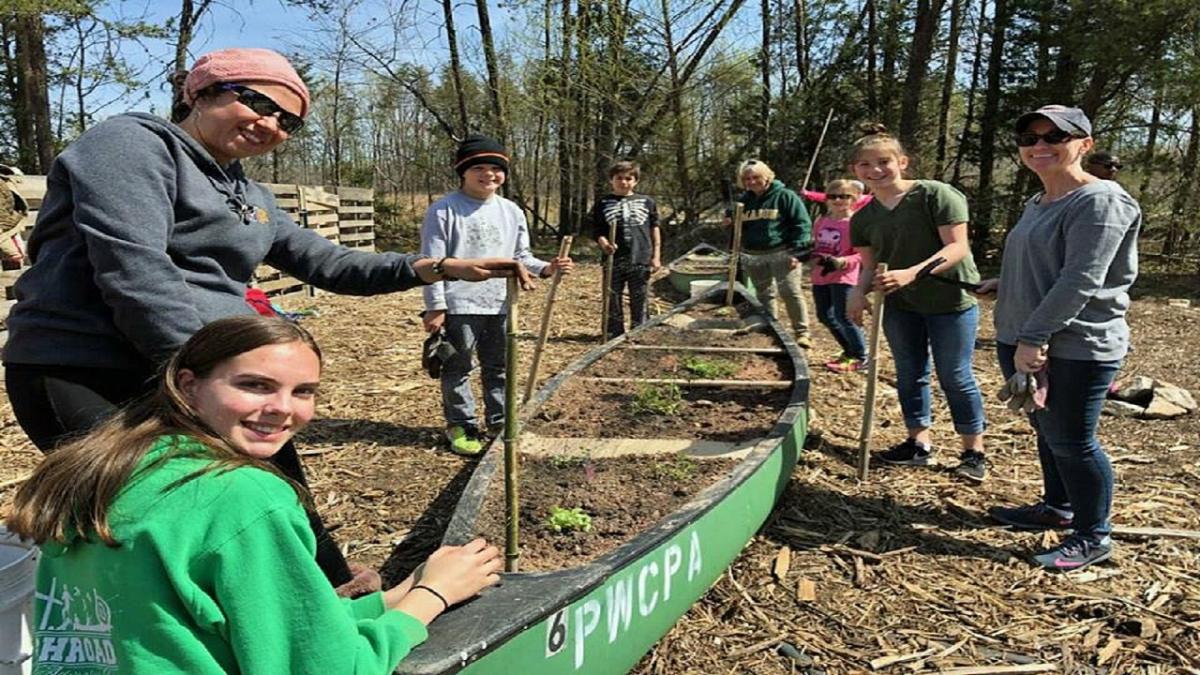 Keep Prince William Beautiful volunteers build pollinator garden.