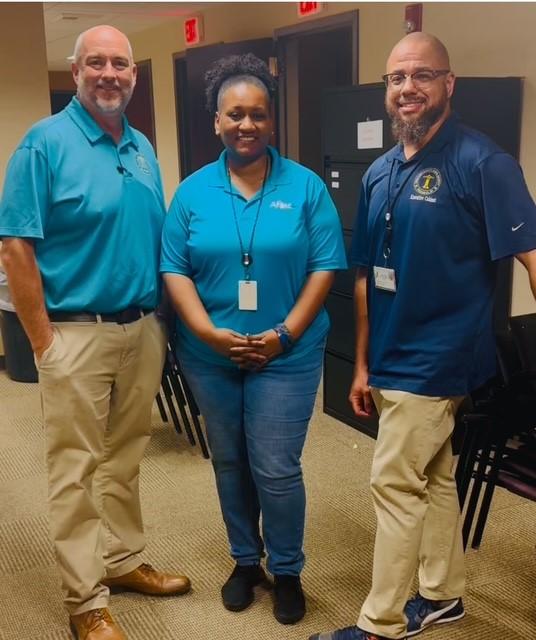 Aflac volunteers shown with representatives from the Chattahoochee Valley school district.