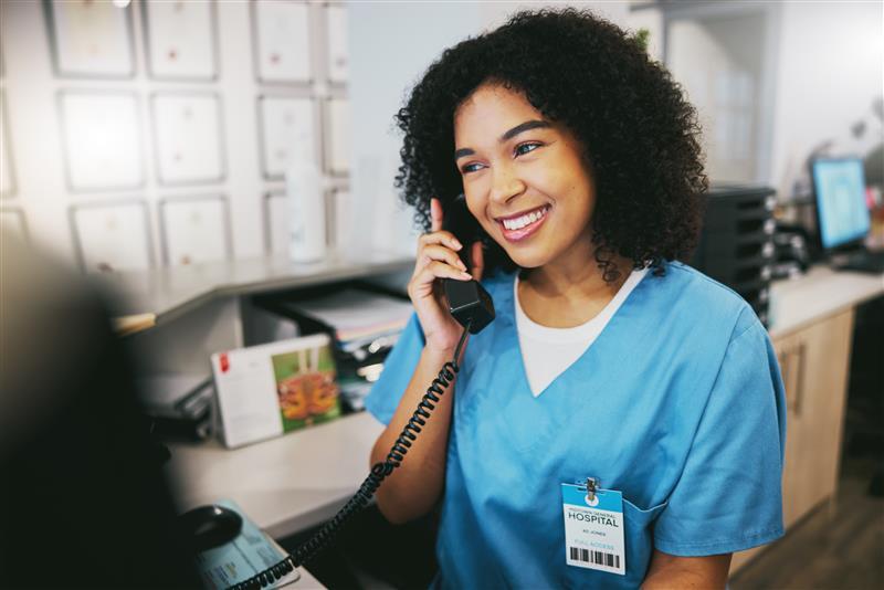 A medical professional taking a phone call.