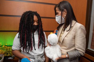 Doctor with patient holding an Aflac duck.