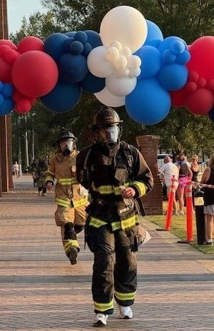 Firefighter shown in the Firefighter 5K race for CURE Childhood cancer.