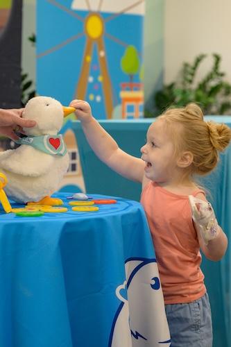 Young patient shown with an Aflac My Special Duck.