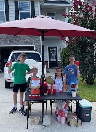 Rowan and his friends at his lemonade stand.