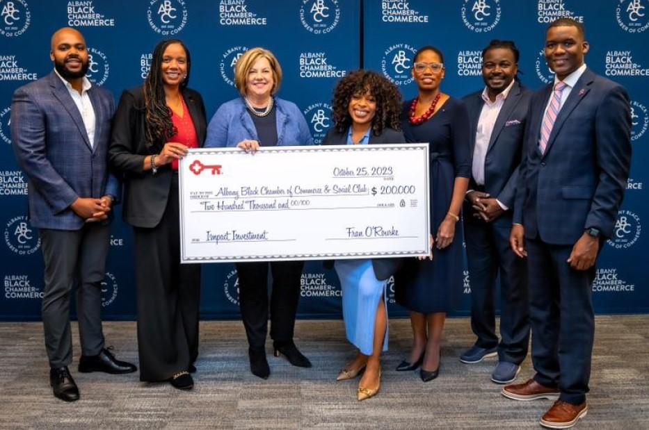 Members of Albany Black Chamber of Commerce and KeyBank representatives holding a $200,000 grant check.