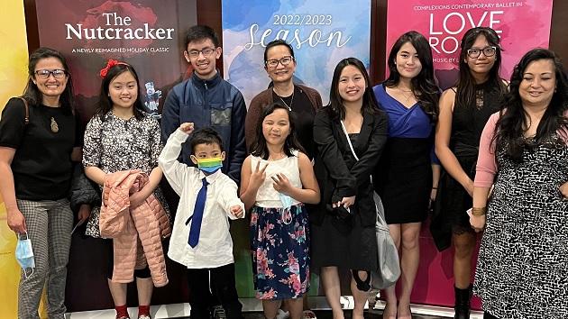 New Canadians take in an Alberta Ballet performance through the company’s partnership with the Saranay Filipino-Canadian Association Saranay Filipino-Canadian Association smiling at the camera
