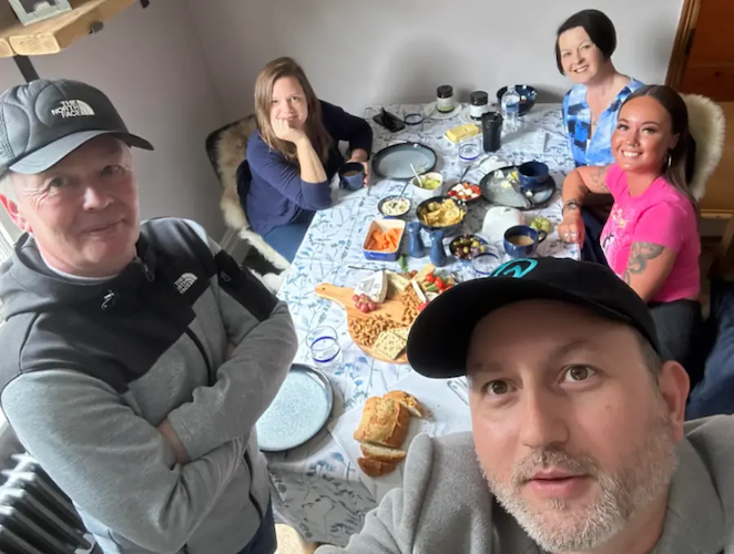 Alejandro at the dinner table with his family.