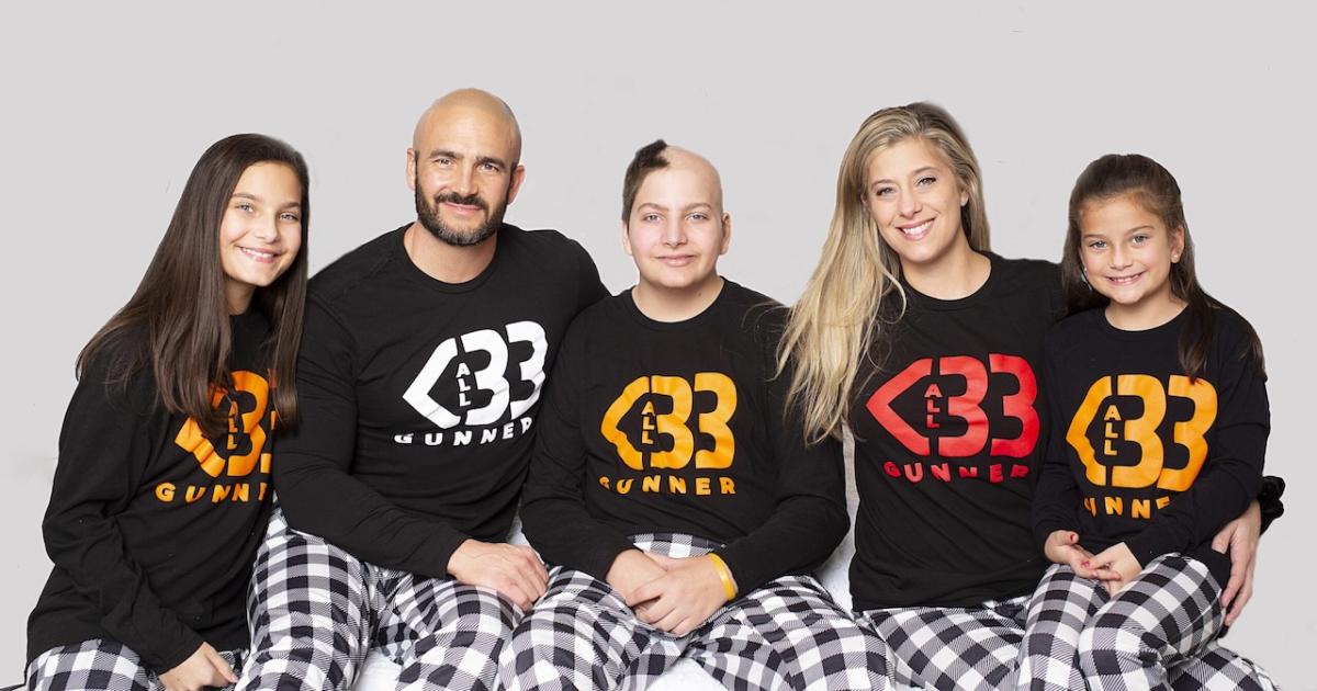 Brittany and family wearing All Heart Gunner sweatshirts. 