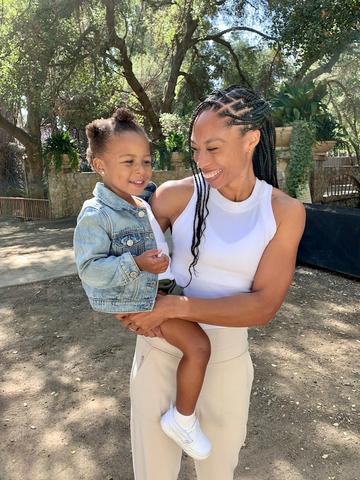 Olympic Gold medalist and mother, Allyson Felix, teams up with Pampers to help raise awareness of the ongoing Black maternal health crisis and the urgent need to raise the quality of care for Black moms. (Photo: Business Wire) Allyson Felix holding her child