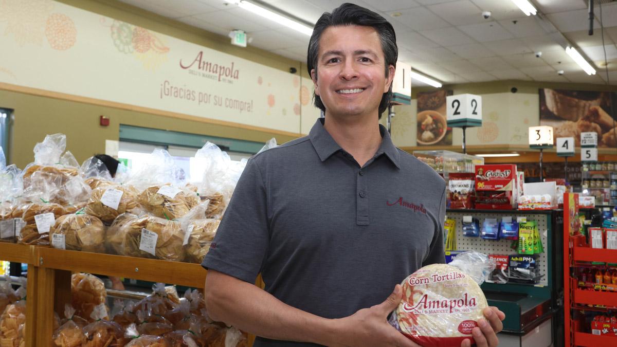 Rolando Pozos with some of the house-made tortillas at the Amapola Market in Downey, California. " "