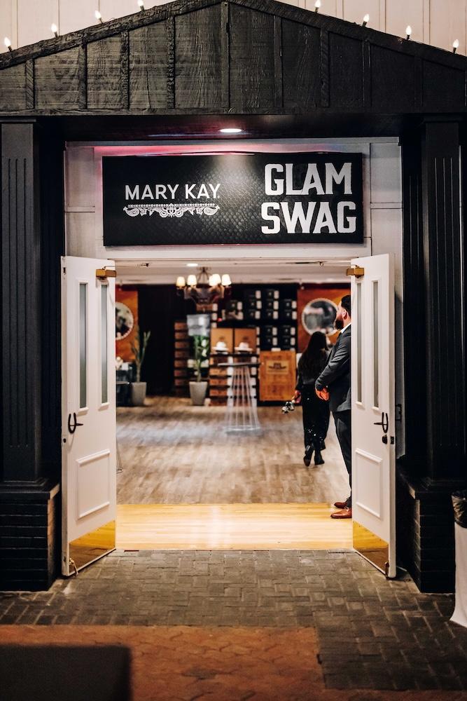 Sign reading, "Mary Kay: GLAM SWAG"