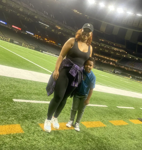 Angora and her son on a football field.