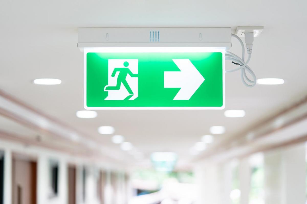 Illuminated green emergency exit sign