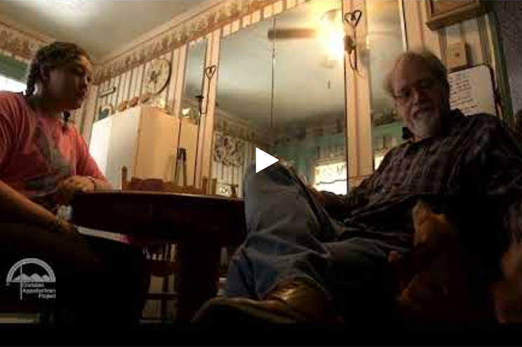 two people sitting together