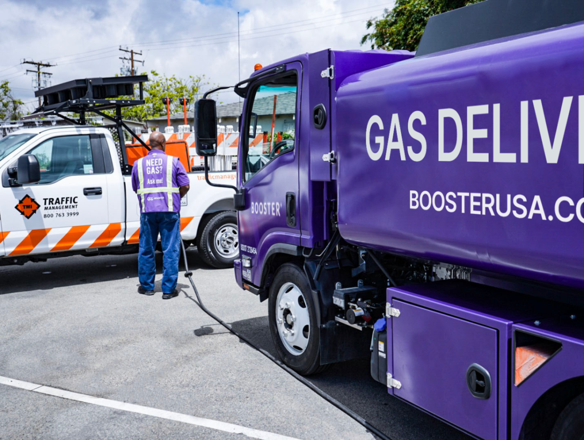 A Booster service professional fuels a Traffic Management truck. 