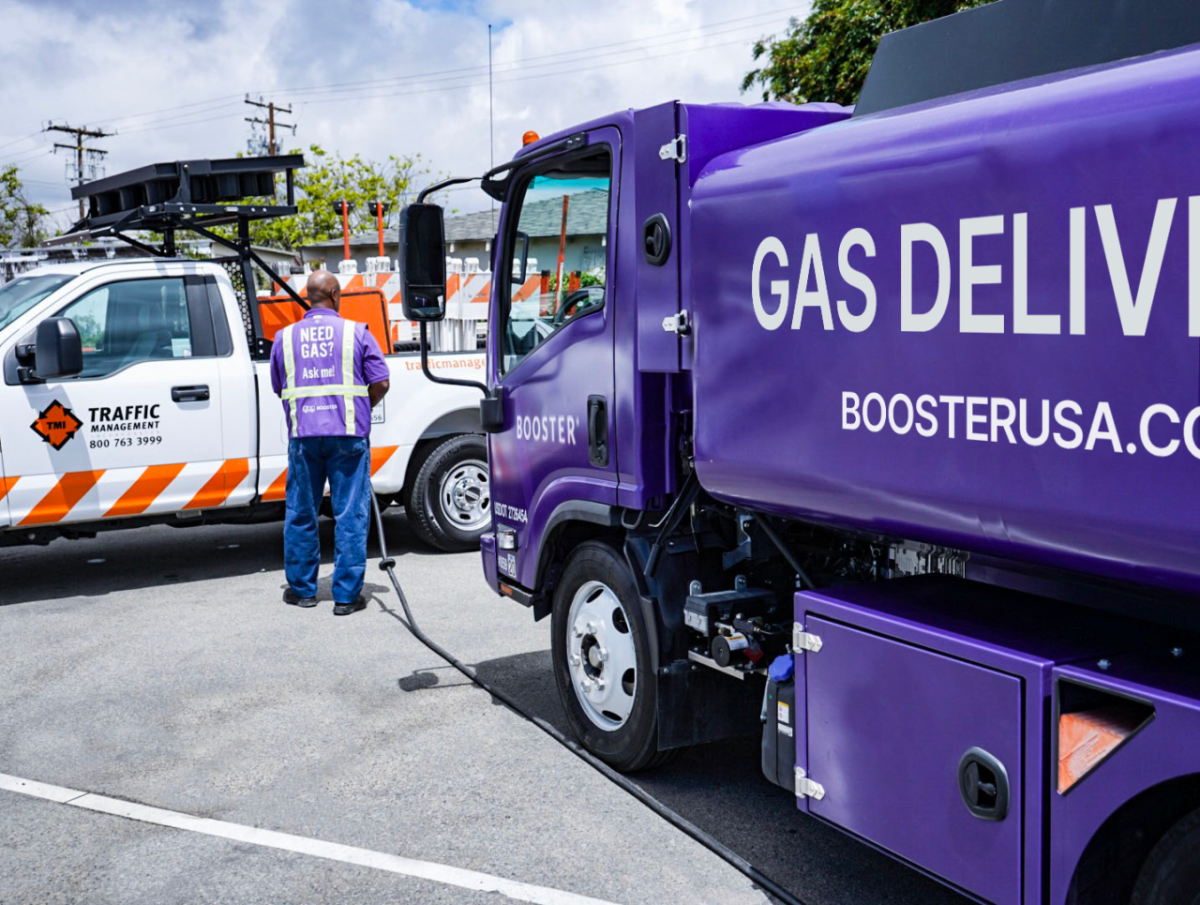 A Booster service professional fuels a Traffic Management truck.
