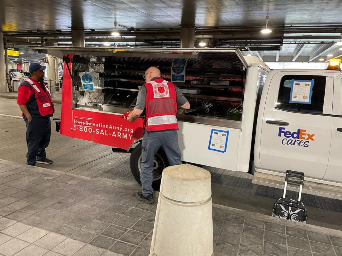 canteen truck workers in red safety vests