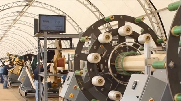 Workers produce the company's innovative liner product at a Smartpipe mobile factory. Workers produce the company's innovative liner product at a Smartpipe mobile factory.