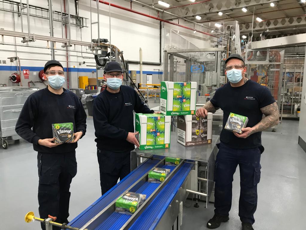 Several of Kimberly-Clark's employees hold Kleenex® products at the company's Barrow manufacturing facility in the UK.