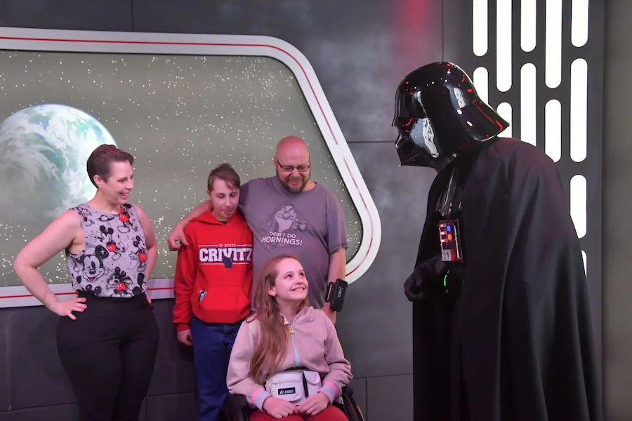 Becky and her family seeing Darth Vader at a theme park.