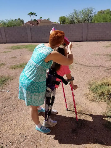 Becky and her daughter in a field.