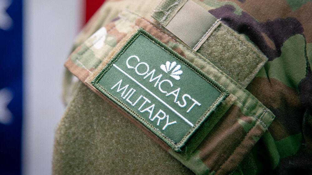 Close up of an arm badge on a military uniform "Comcast Military".