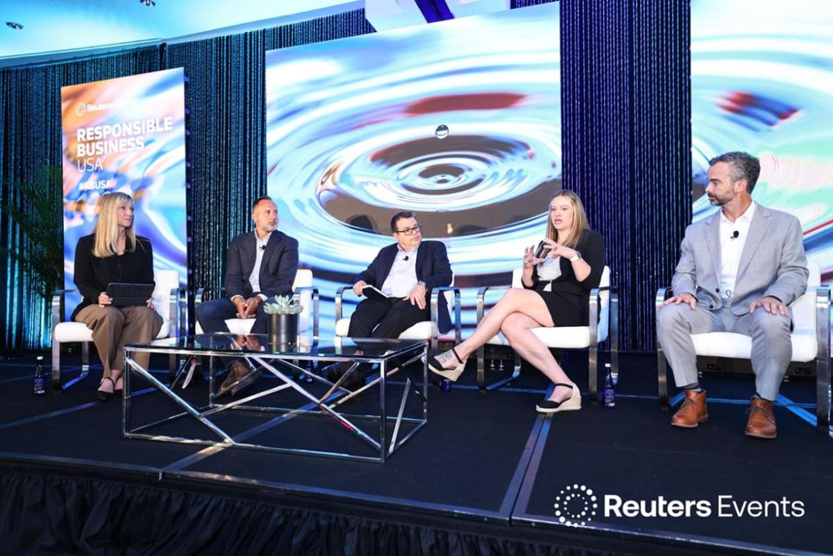 Panelists lead discussion on stage