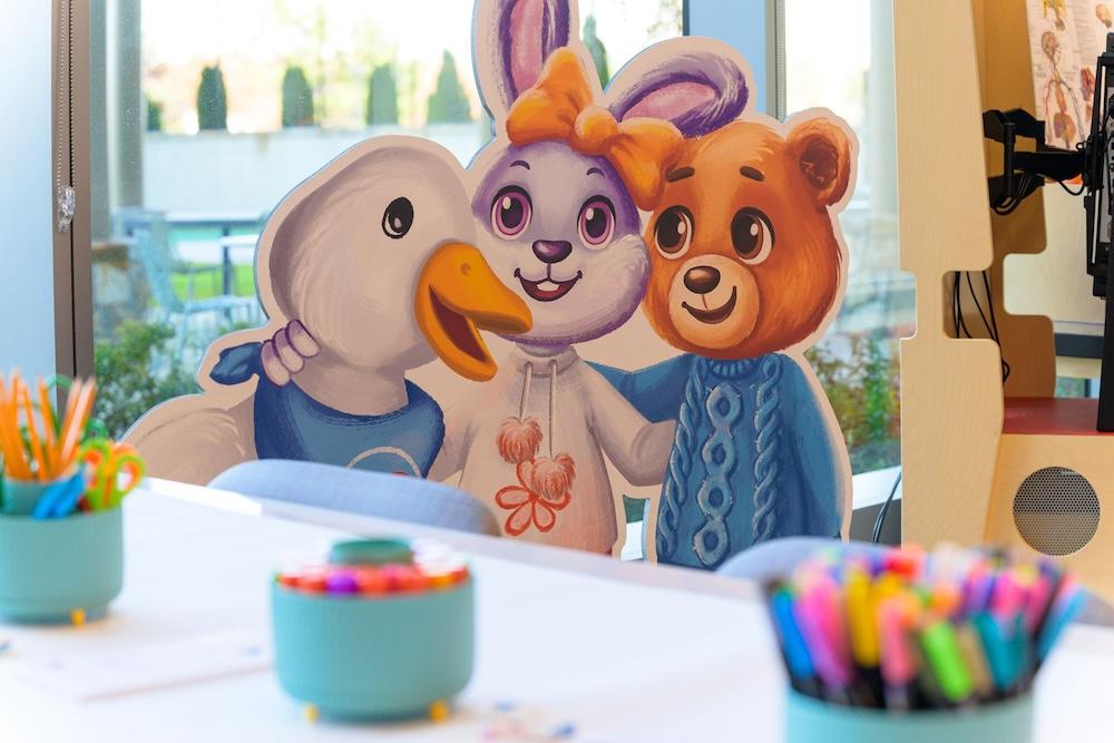 The Aflac special duck shown with a bunny and a bear.