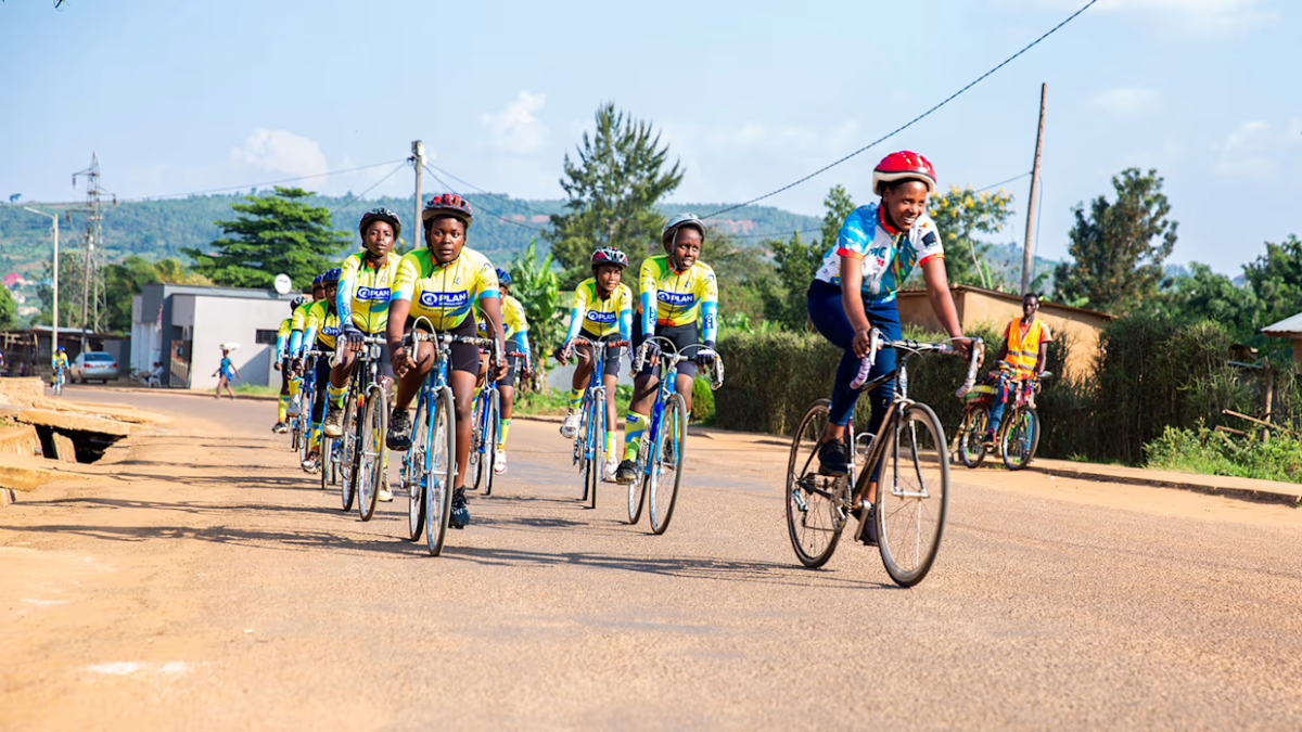 A group riding bicycles down the street