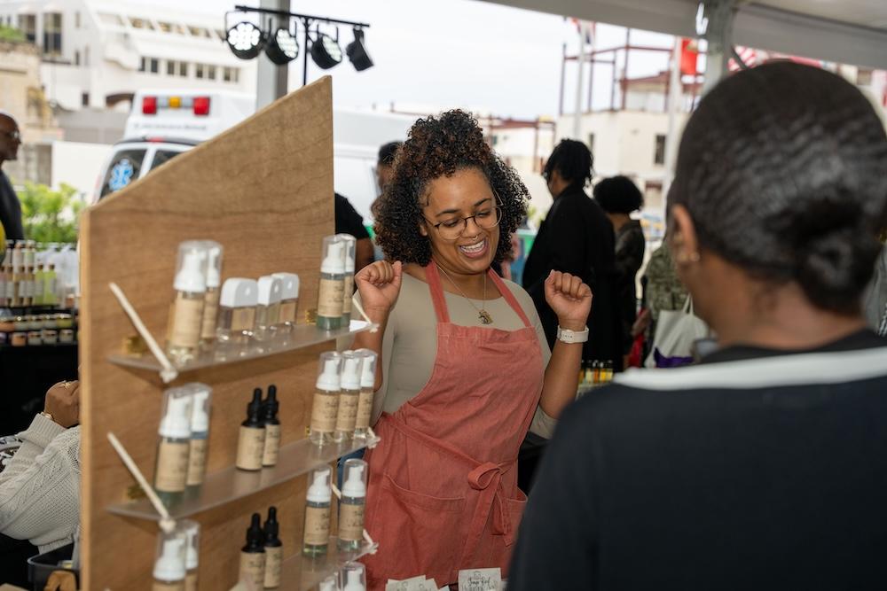 vendor speaking with a customer at Bacardi's Annual Black-Owned Vendor Market