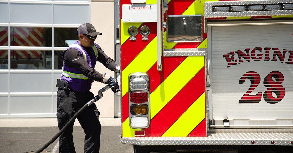 Booster refueled nearly 50 individual vehicles ranging from CAL FIRE-owned emergency vehicles to contracted heavy equipment such as the bulldozers used to build fire breaks. A Booster service professional fuels a fire engine with the number 28 on the back.