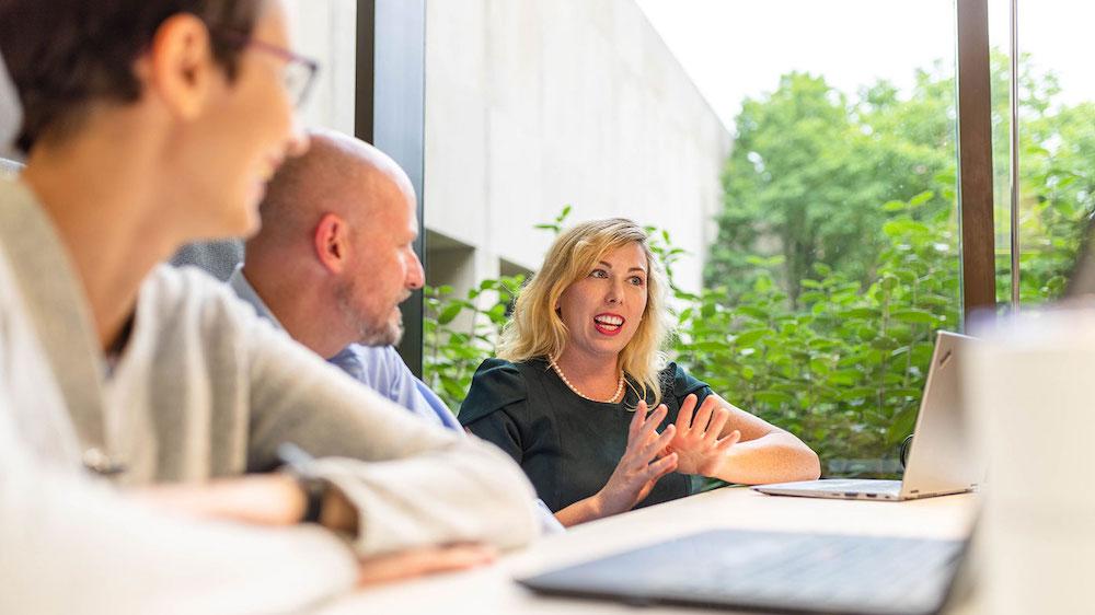 Julie Meade, PhD, scientific writer, Global Scientific and Regulatory Documentation, collaborates with colleagues in her role at Bristol Myers Squibb.