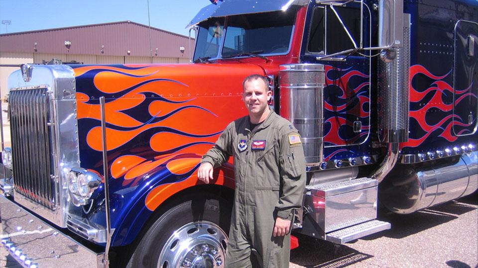 Buddy Martens standing next to truck