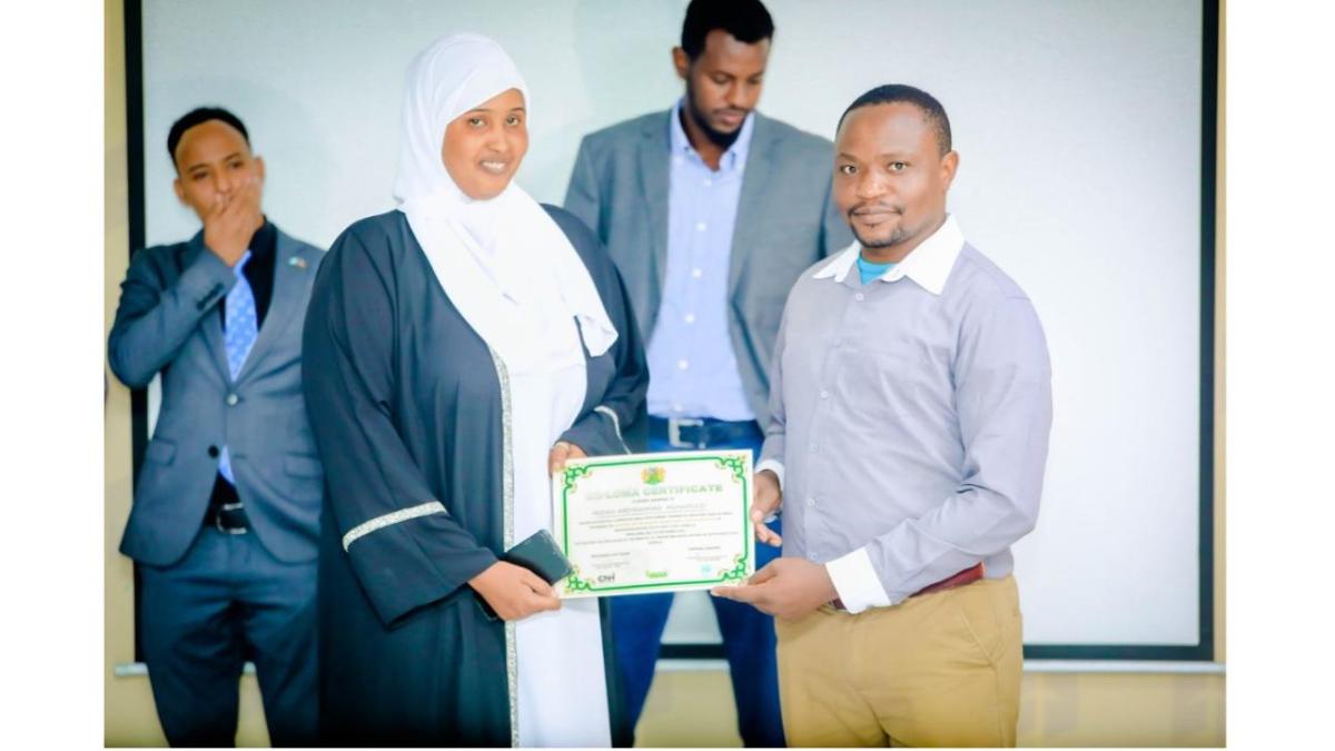 Two people holding a certificate 