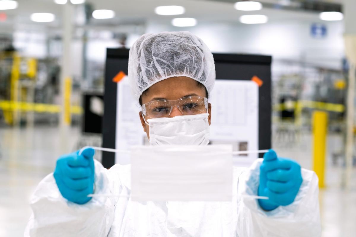 Workers begin final preparation for manufacturing Level 1 face masks Wednesday, April 1, 2020 at the General Motors facility in Warren, Michigan. (Photo by John F. Martin for General Motors)