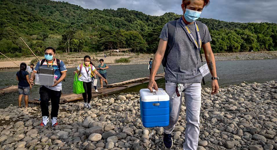 people carrying cold boxes