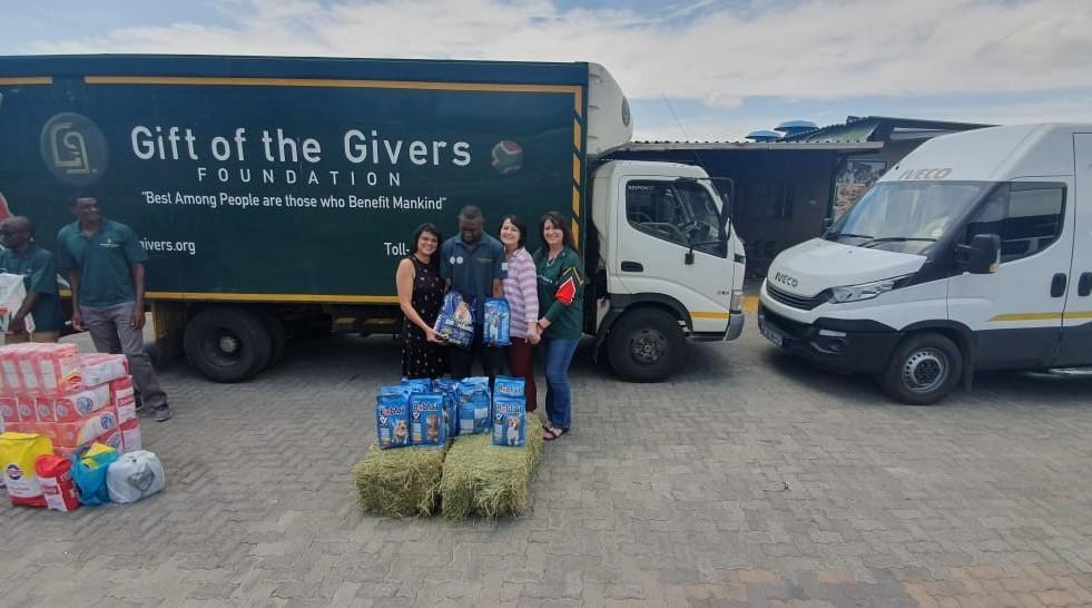 CNH Industrial South Africa employees pose together with the team from Gift of the Givers as they set off with donated supplies