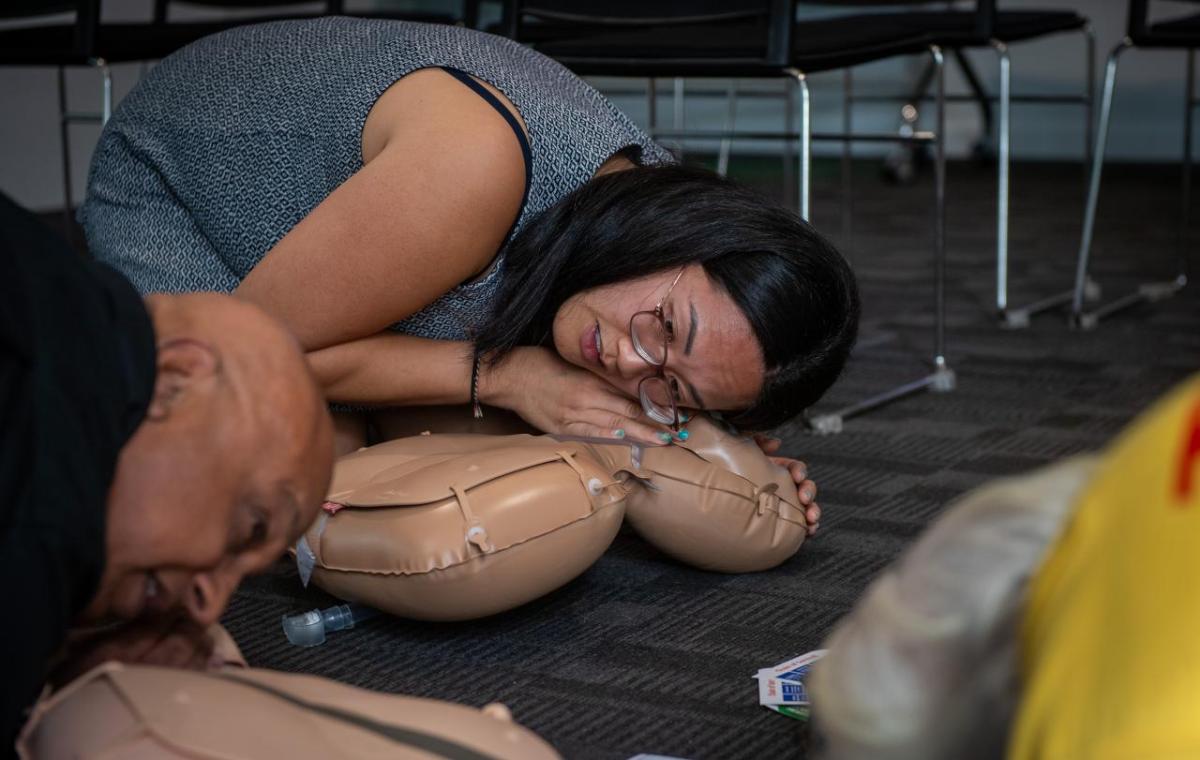 person practicing CPR