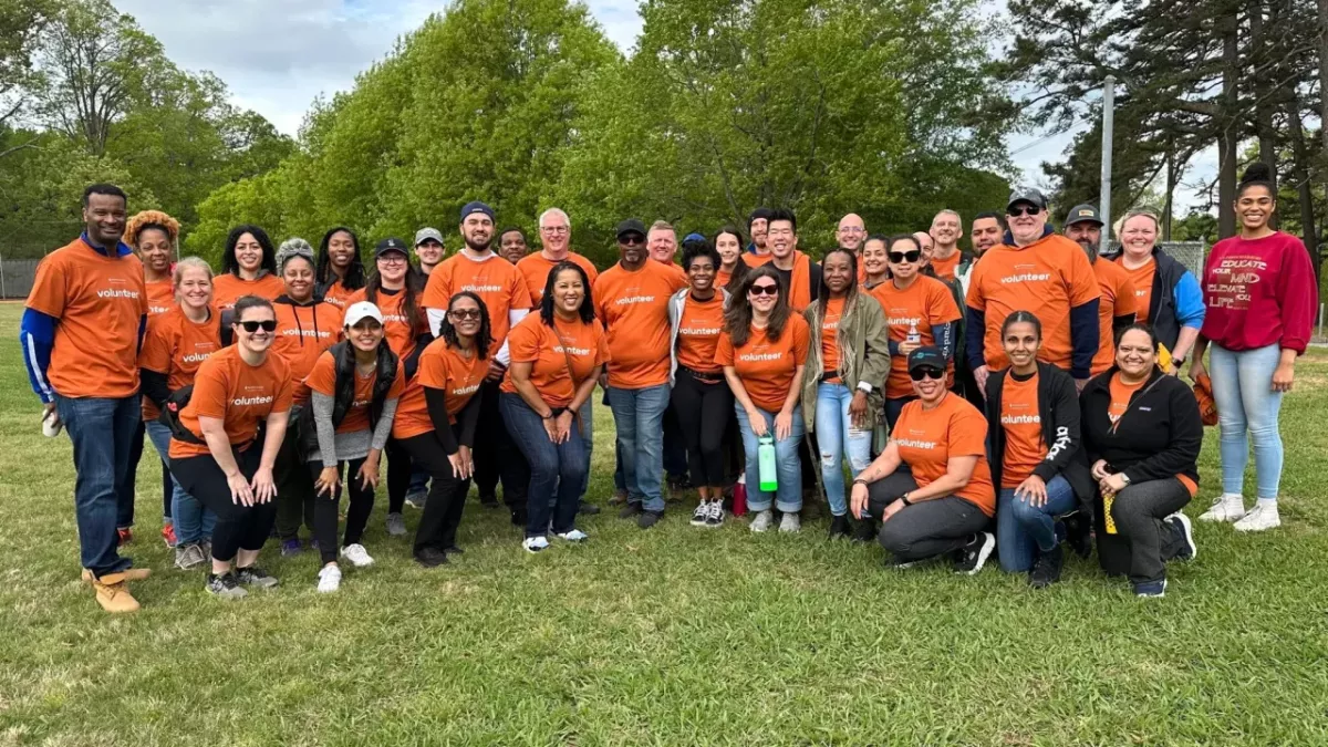 A large group of volunteers smiling 