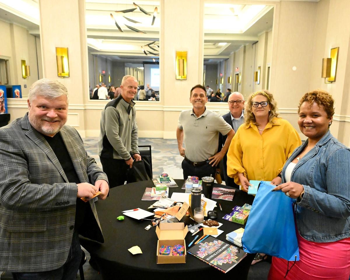 CCO Staff Mark Foster, Scott Benke, Ron Townsend, Dave Harkess, Casey Lyons, and Alex Lewis assemble “Feel Better Bags” for ChildSavers of Richmond, VA. " "