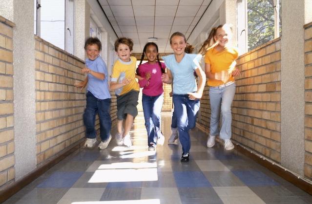 Children running in a hall.