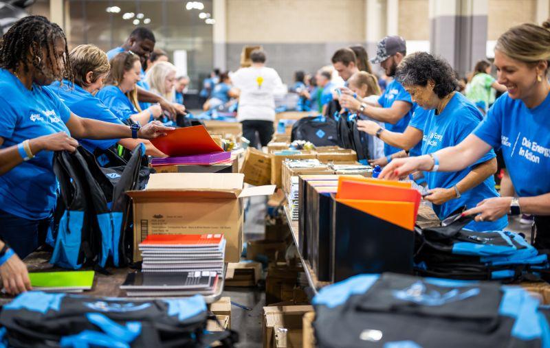 volunteers packing backpacks